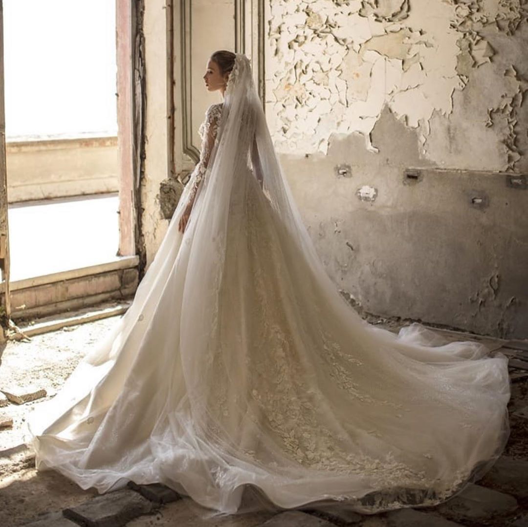 Elegant Deep V-neck Wedding Dress with Appliques, Lace, Ruffles, and Tulle