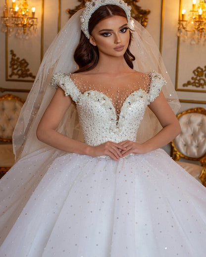 Glamorous Off-the-Shoulder Beaded Princess Wedding Dress with Pearl Tulle